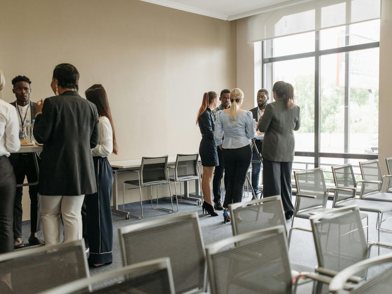 Man looking at green trees through a window during a work break